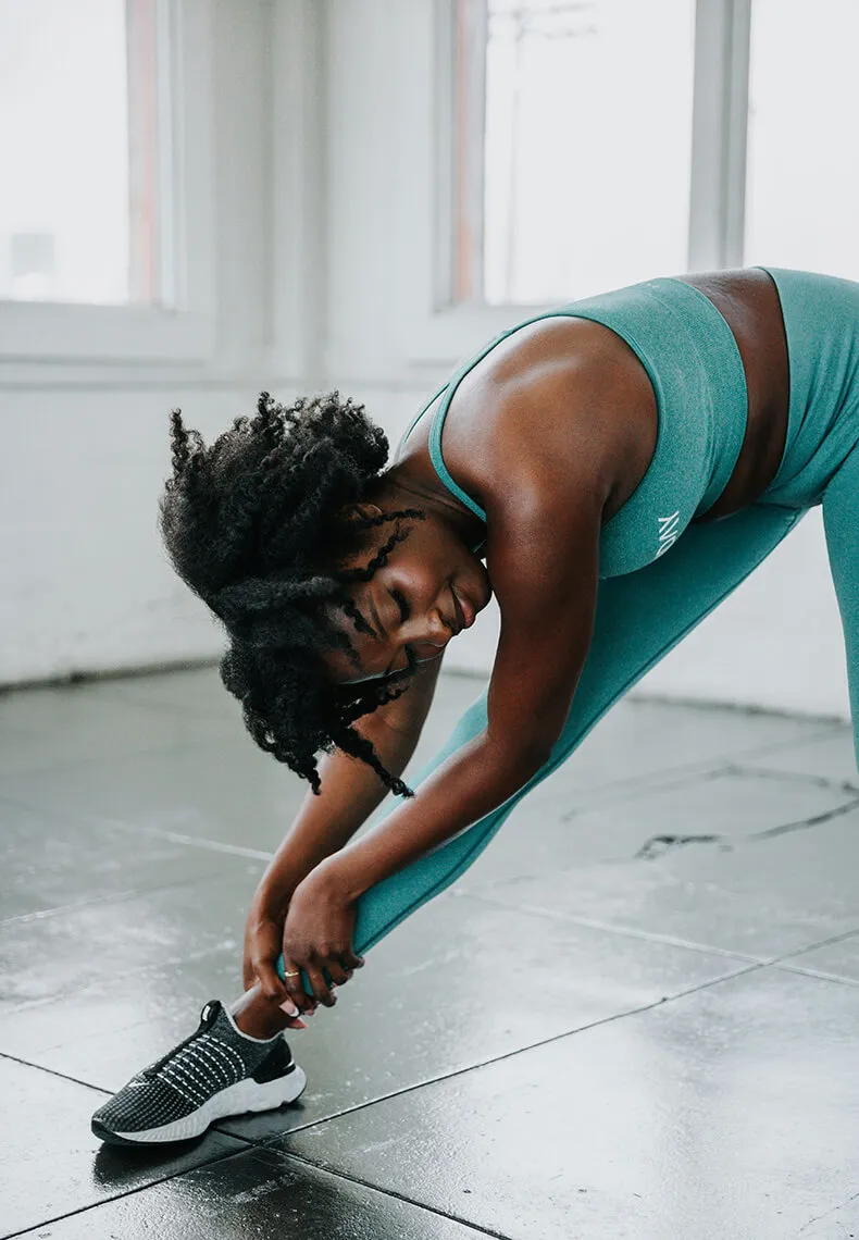 woman stretching after workout